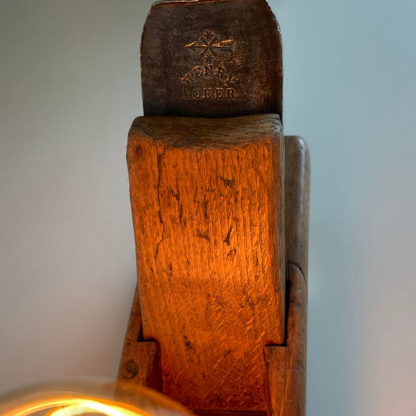 Timber table lamp with 18th Century manufacturer's brand on plane's cutting blade.s