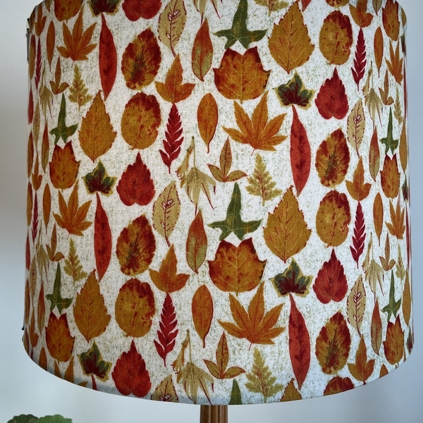 Variety of yellow and orange autumn leaves on large fabric lamp shade, made in New Zealand.