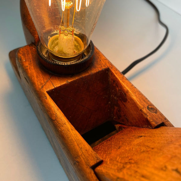 Wooden table lamp, close up of central portion and edison light